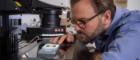 A researcher studying a roman coin