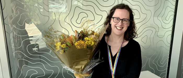 Photo of Breda Cullen holding a bunch of flowers